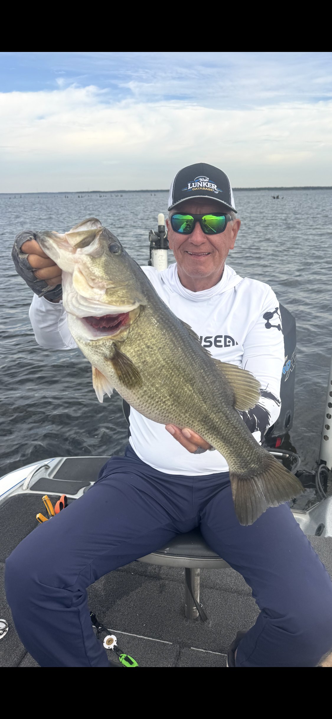 Louie Cruz holding their catch